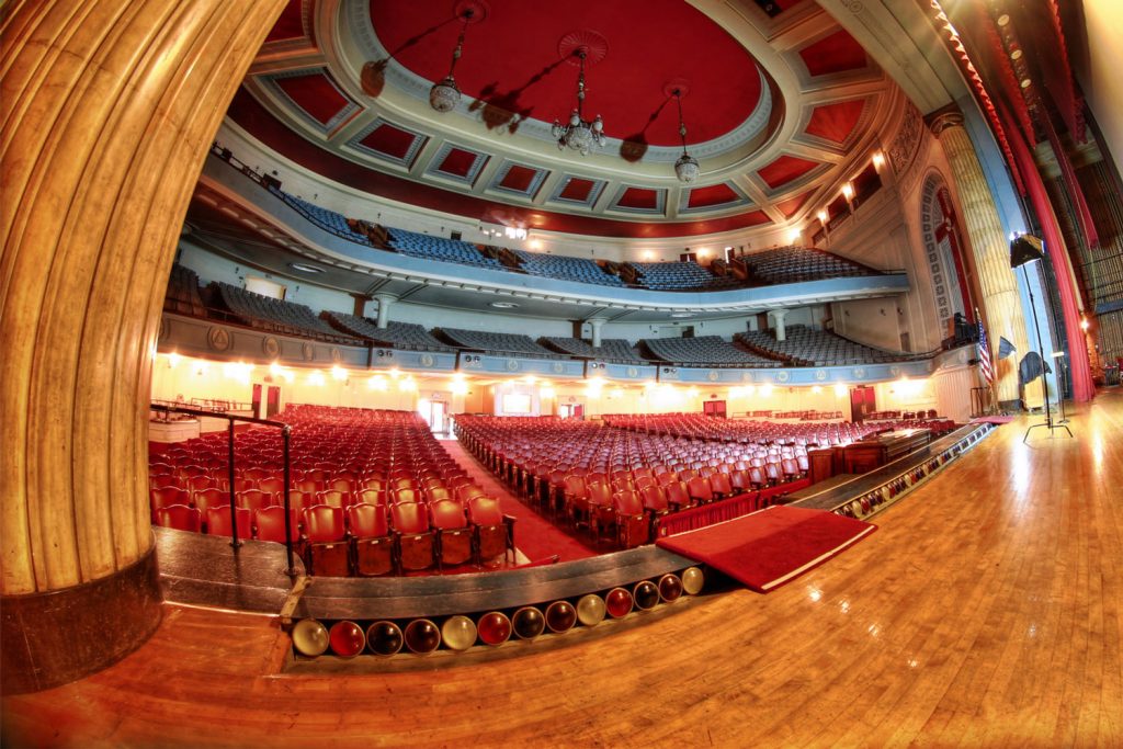 A view from the stage across the theater’s red seats