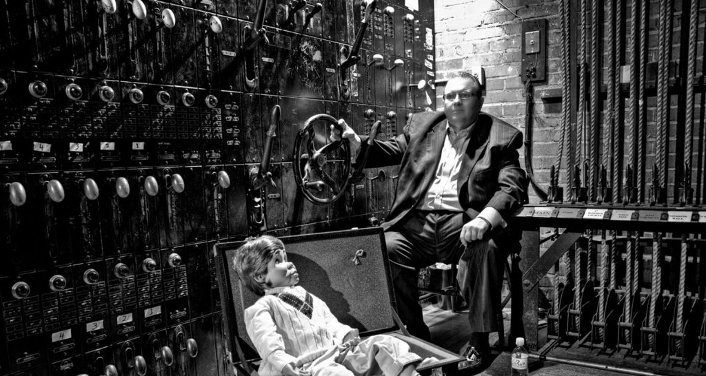 Jimmy and Bobby backstage beside a theater switchboard